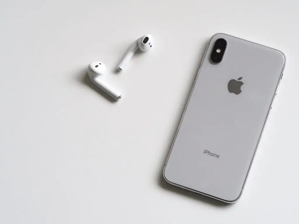 AirPods Blinking Green - AirPods and an iPhone